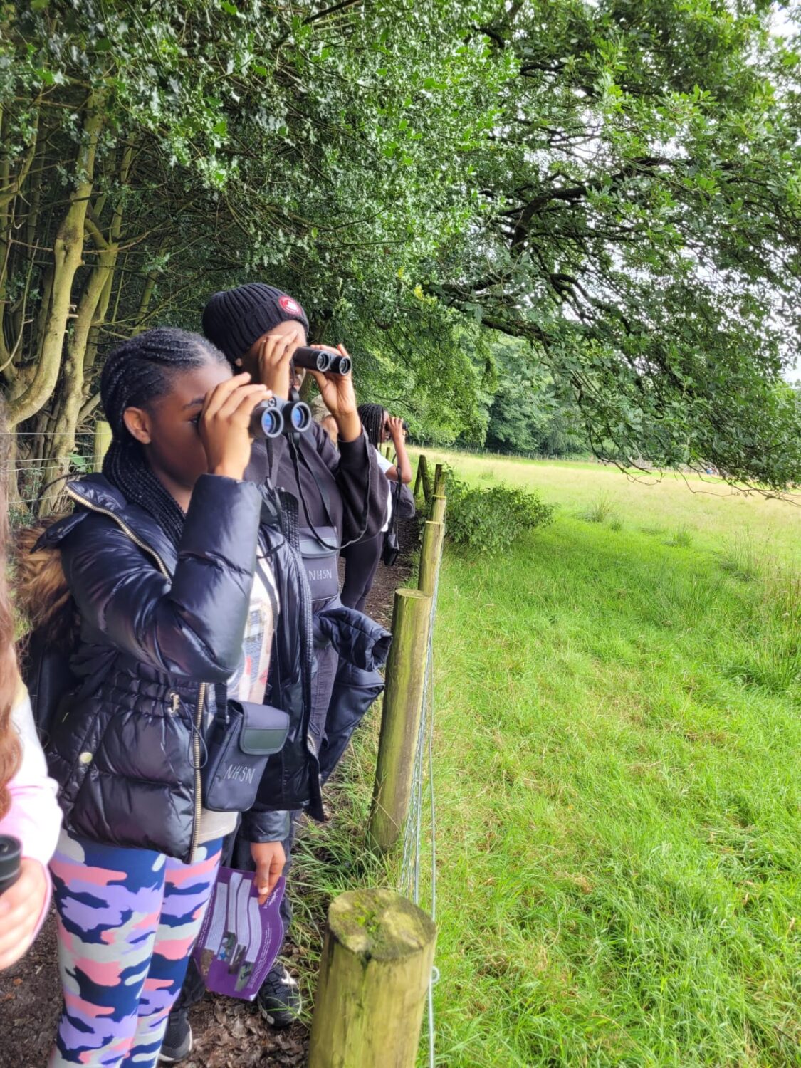 Young people birdwatching as a part of the Lantern Fund project